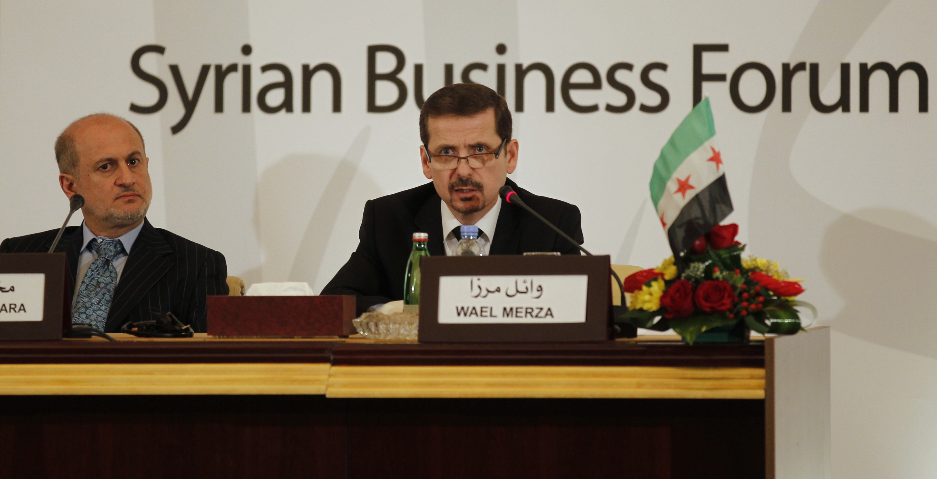 Dr. Wael Mirza, a Syrian dissident working independently with the Syrian opposition abroad, speaks during the Syrian Business Forum in Doha