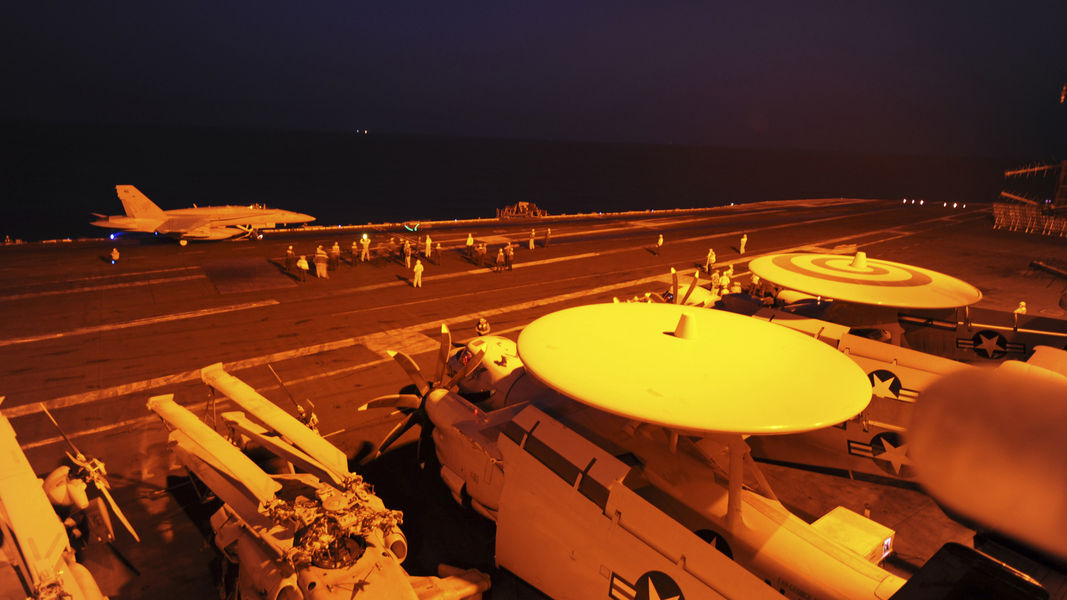 An F/A-18C Hornet prepares to launch from the flight deck of the aircraft carrier USS George H.W. Bush (CVN 77) to conduct strike missions against ISIL targets, in the Gulf